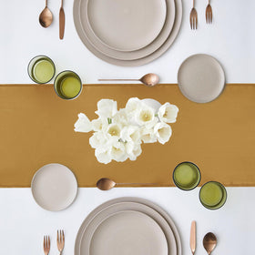 Yblut satin table runner used as chair decoration for a bow accent.