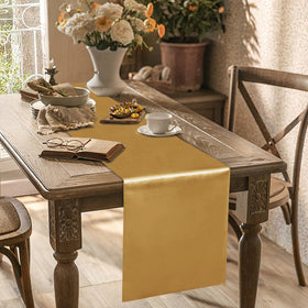 Yblut old gold satin table runner on a wedding setup adds elegance.