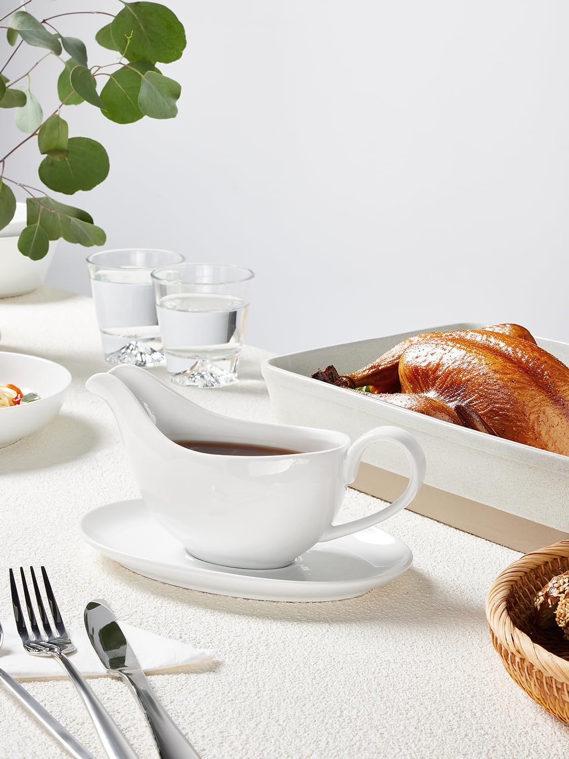 Yedio 18 oz porcelain gravy boat, side view showing capacity.