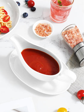 Yedio gravy boat on festive table setting with turkey.
