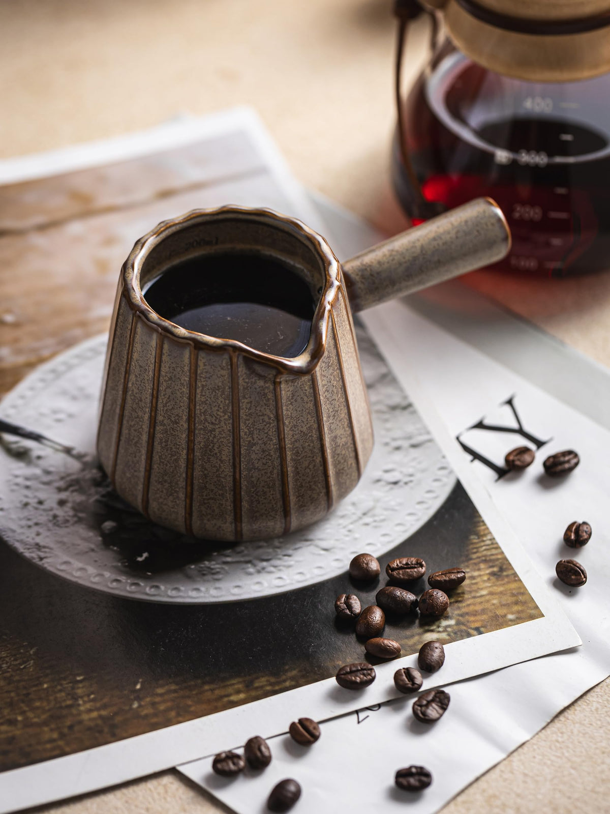 YHOJOY espresso-shot measuring cup for accurate dosing.