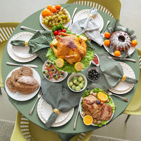 YIDAKO sage-green round tablecloth on table shows ample coverage for 8-10 seats.