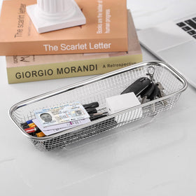 Yoku Made compact basket stores small gadgets, maximizing depth-efficient storage.