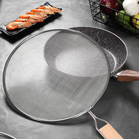 YOLOPLUS+ 9.44-inch splatter screen in-use on stovetop protecting against splatter