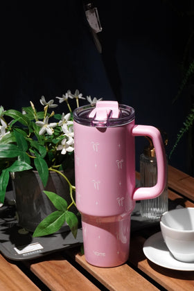 YOME Bow Pink tumbler with flip straw lid for quick sips on the go