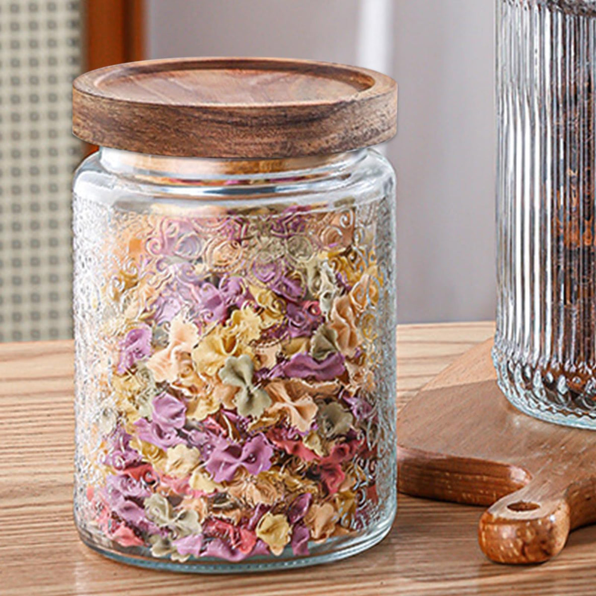 Yoqelt vintage glass jar with carved-flowers lid preserves nuts crisply and beautifully.