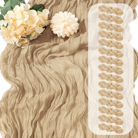 Yorcari beige cheesecloth table runner draped on a wooden table for warm wedding decor