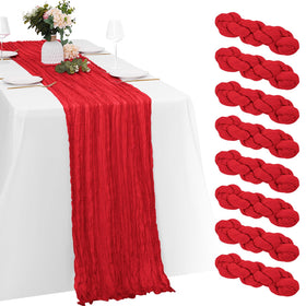 Yorcari red cheesecloth table runner shown on a long banquet table for rustic wedding decor