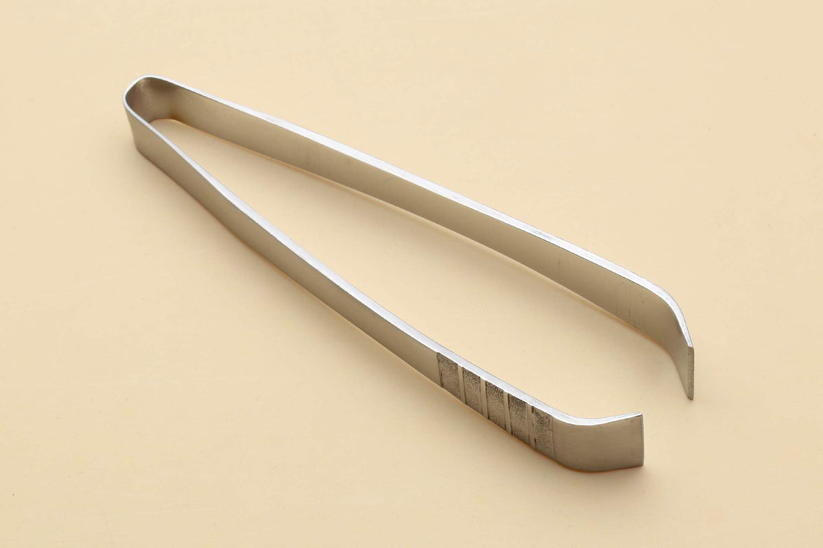 Yoshihiro sushi garnishing tool enhances delicate plating with control.