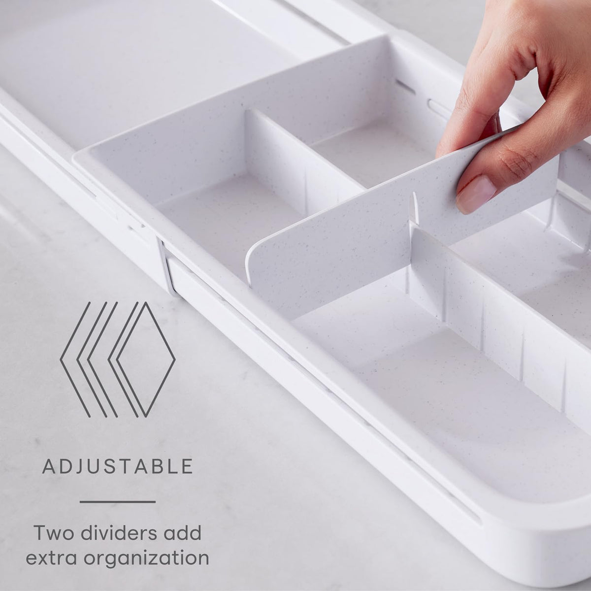 YouCopia DrawerFit locking-teeth keep the tray steady at the right length
