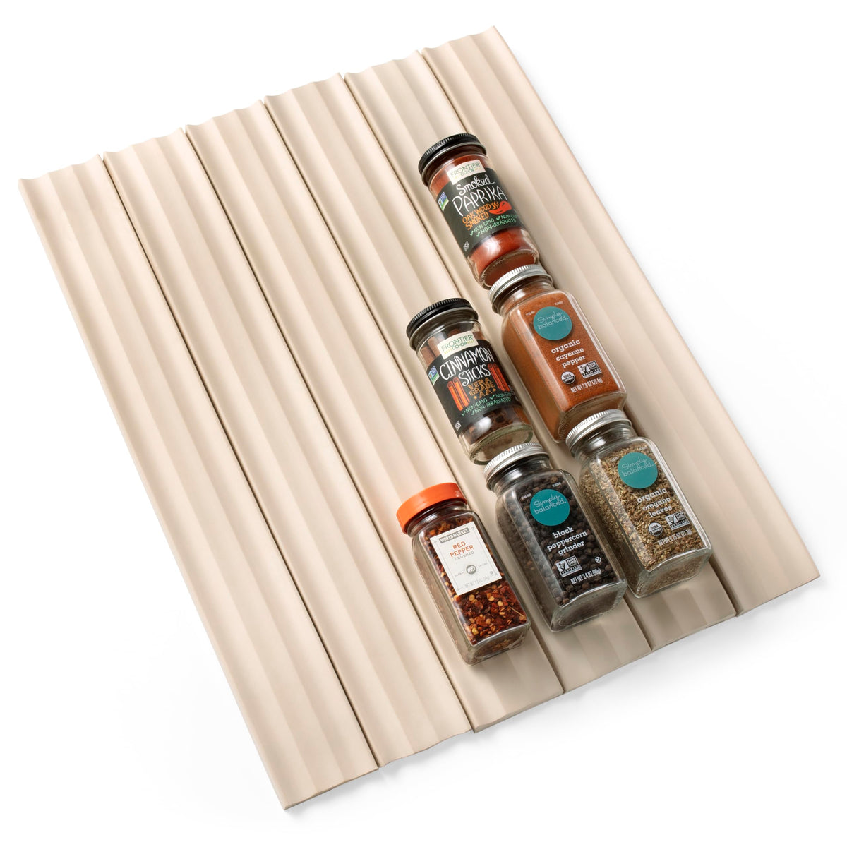 YouCopia SpiceLiner measures your drawer length for a precise fit.