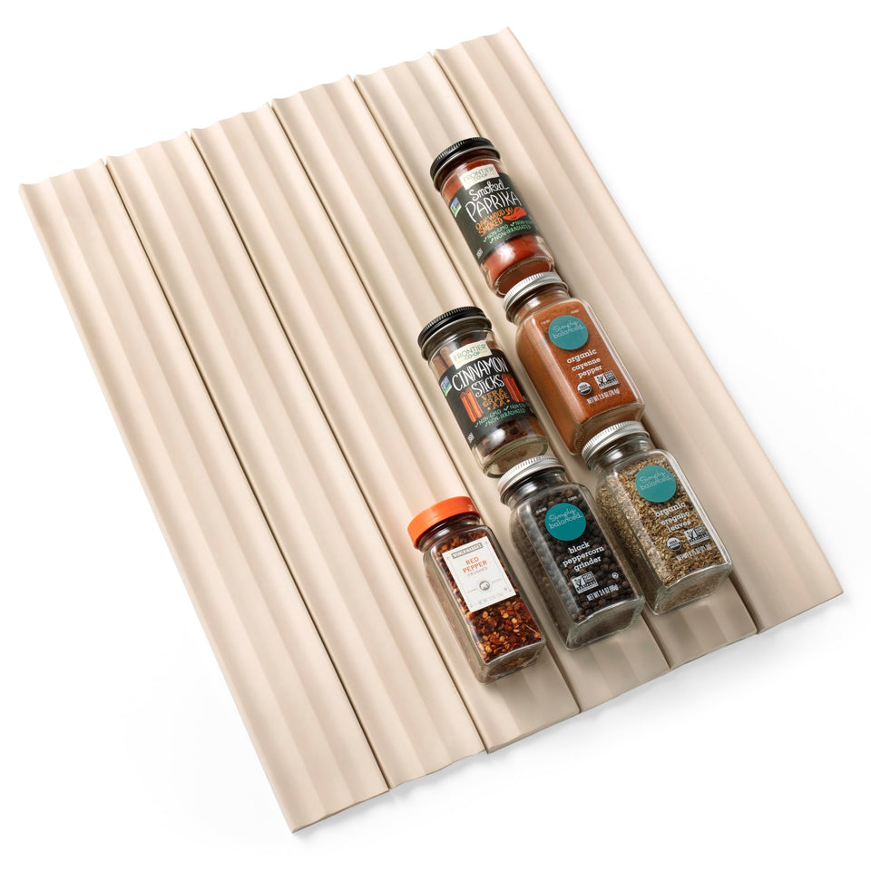 YouCopia SpiceLiner measures your drawer length for a precise fit.