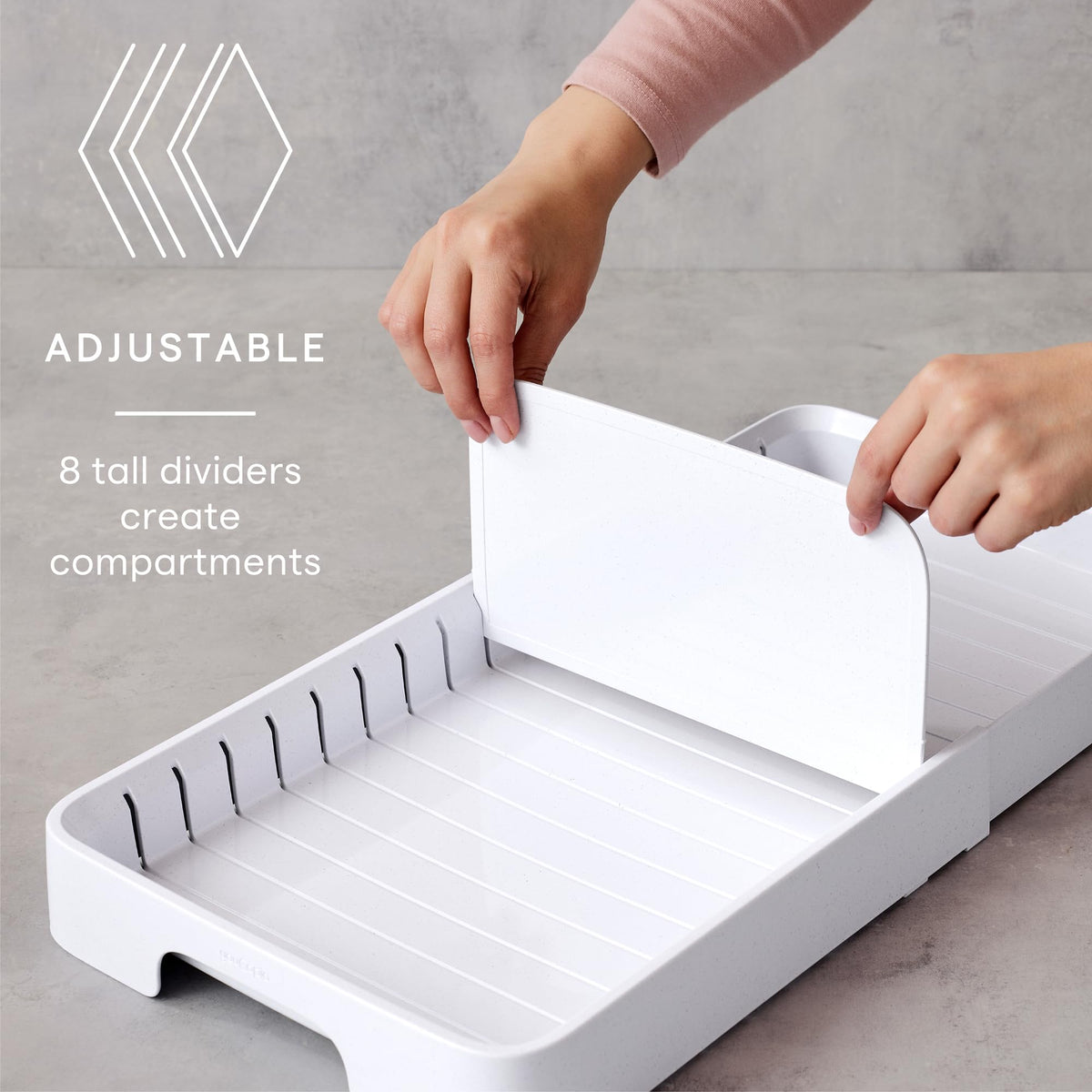YouCopia StoraLid expands to fit larger cabinets for more lid storage.