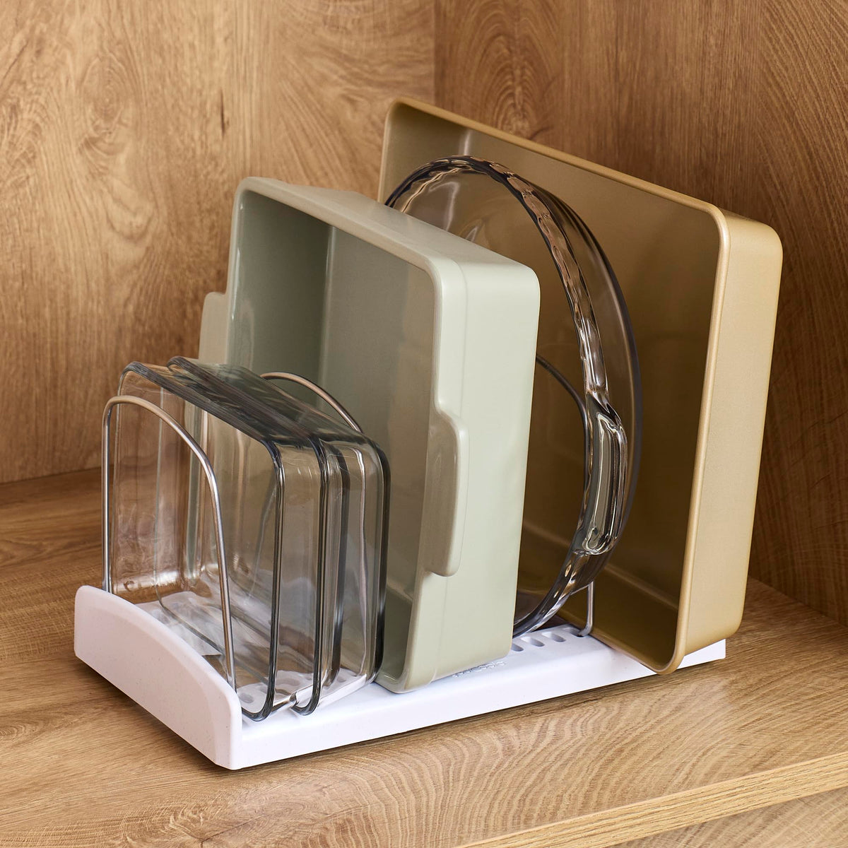 YouCopia StoreMore Bakeware Rack with dividers installed shows organized upright bakeware.