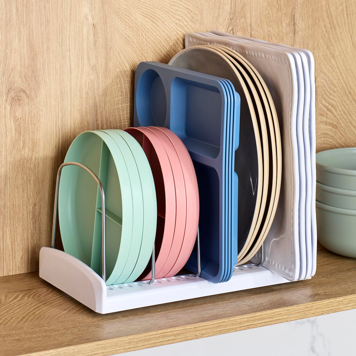 YouCopia StoreMore Bakeware Rack open-base design prevents lids from rolling.