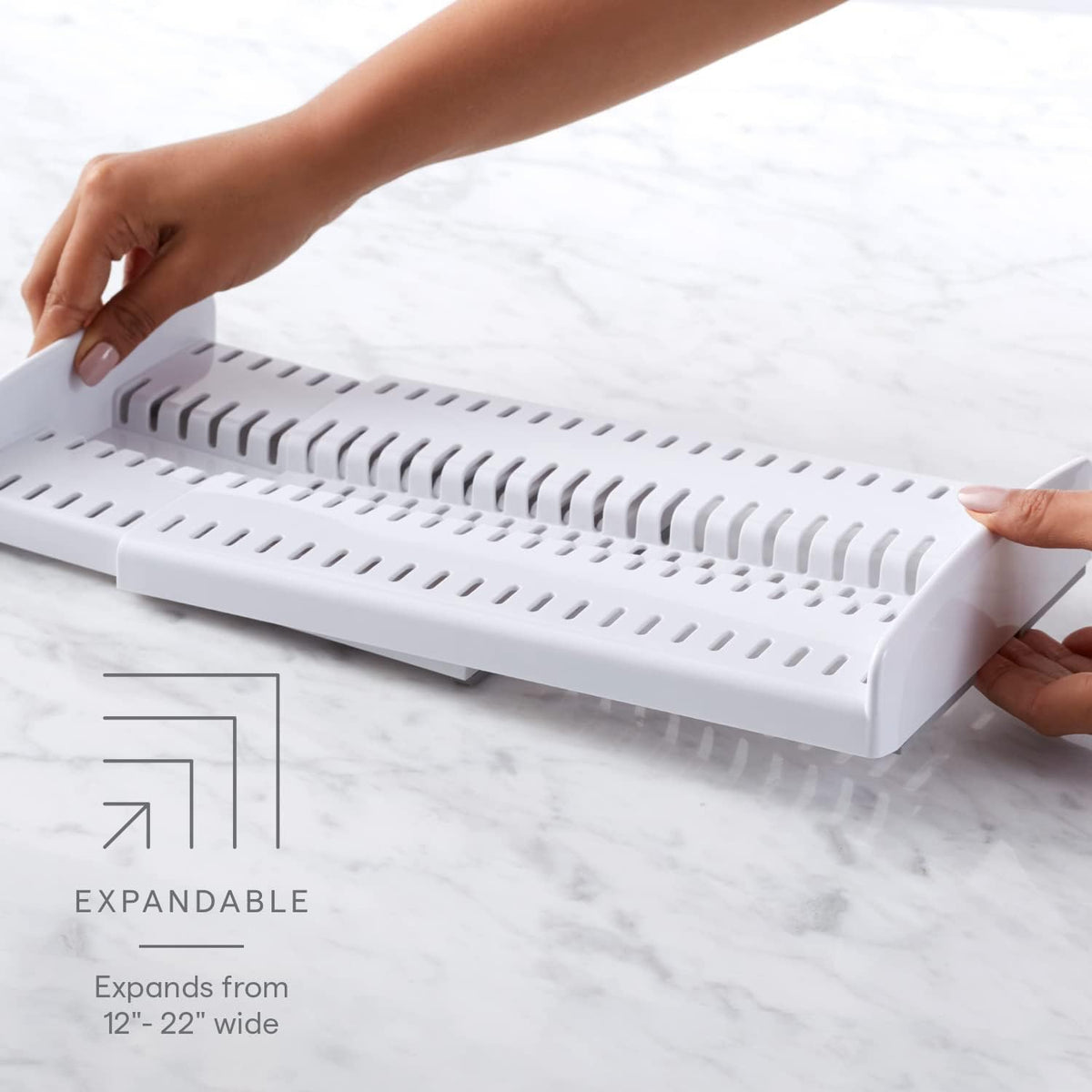 YouCopia StoreMore adjustable dividers hold pans upright for quick access.