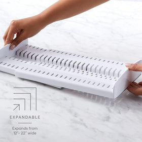 YouCopia StoreMore adjustable dividers hold pans upright for quick access.
