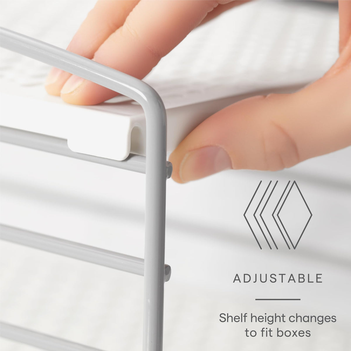 YouCopia UpSpace cabinet storage system clarifies shelf space for boxes and wraps.
