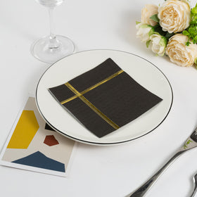 Your Dream Party Shop elegant black and gold napkins with a striking gold stripe
