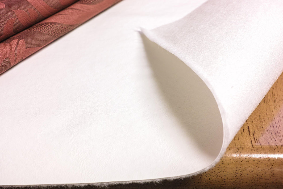 Yourtablecloth Deluxe table pad with embossed vinyl top protects surfaces from heat and spills.