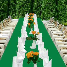Holiday party setup with YSYJ green tablecloth on a long table.