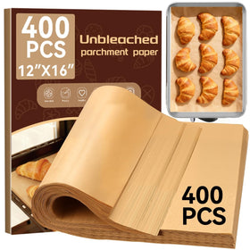 YUANYE 400pcs parchment paper sheets laid flat on a baking tray, non-stick surface shown