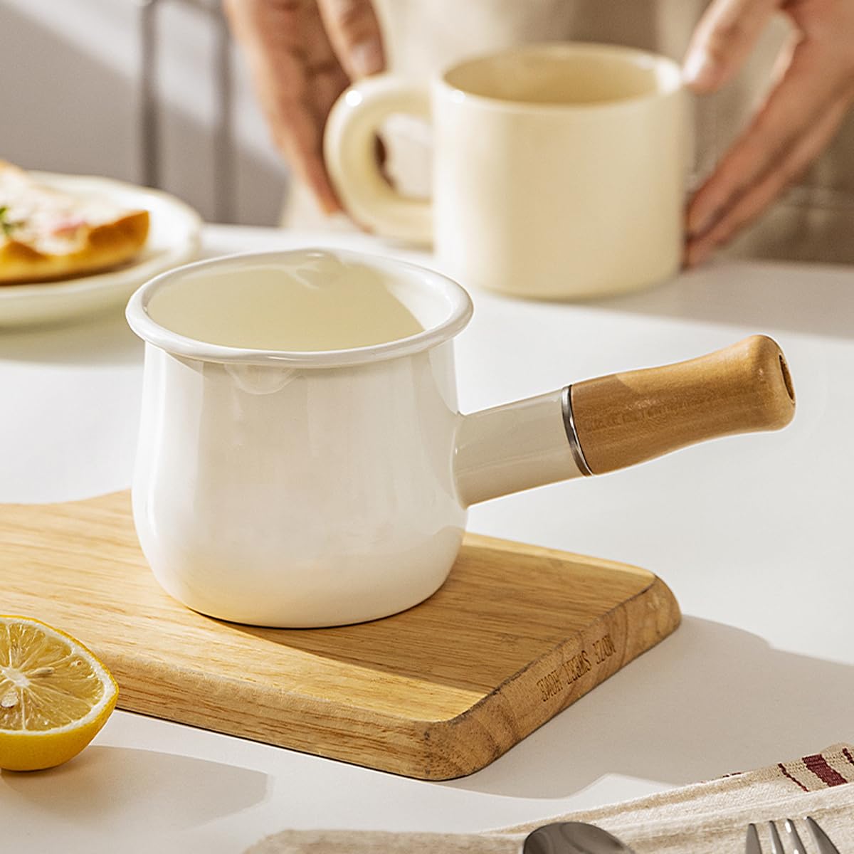 YumCute Home enamel milk pot chili red color in kitchen setting.
