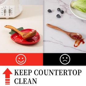 YumiPLUS red strawberry spoon rest on counter helps keep stovetop clean during meals.