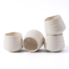 YumiPLUS speckled 5oz tea cup set on white table, ideal for everyday tea rituals.