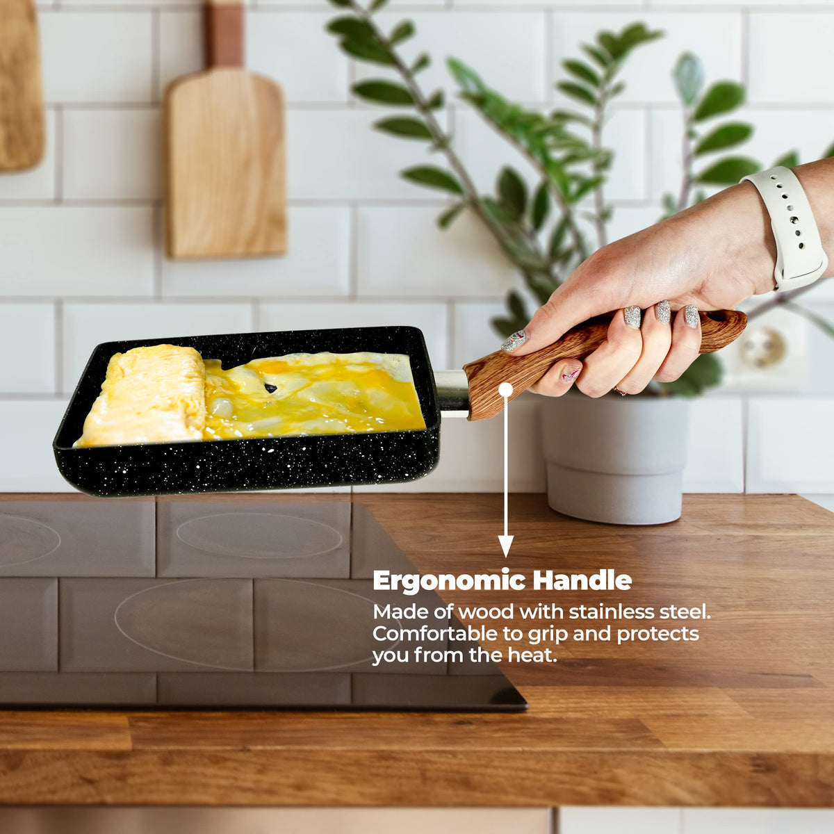 YumOmNom Tamagoyaki Pan ergonomic wooden handle offers comfortable grip during cooking.
