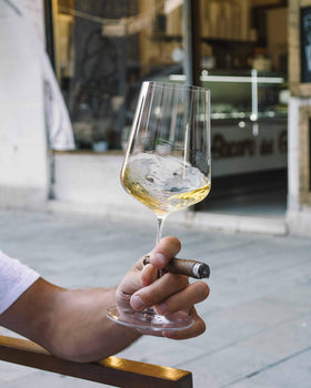 Zalto Denk'Art Universal stemmed wine glass on a dining table for versatile tasting.