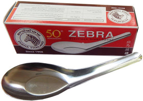 Zebra silver rice soup spoon in use, perfect for bowls of rice and broth.