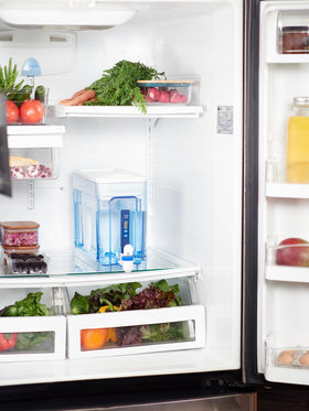 Pouring water from the ZeroWater 32-cup dispenser for daily use.