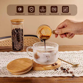Gold-toned spoons paired with mugs for elegant table setting.