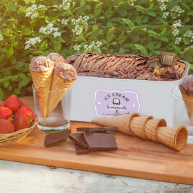 Hands scooping ice cream from a ZICOTO tub for serving.