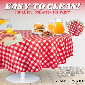 ZIMPLEWARE red gingham round tablecloth used outdoors for a party setup.