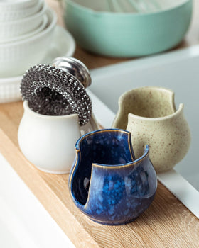 Zoeeker bathroom sponge holder ceramic helps organize essentials near the sink.