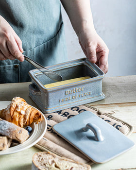 Zoeeker butter dish complements kitchen decor with a neutral gray tone.