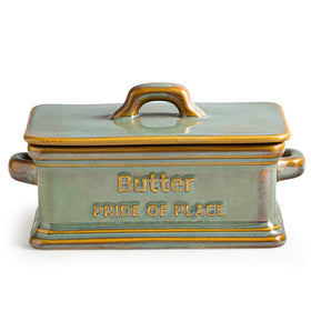 Zoeeker butter dish with green lid on the counter keeps butter ready for use.