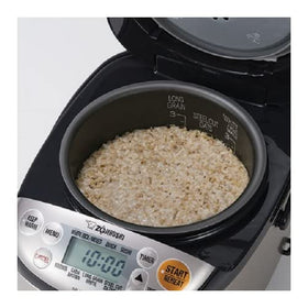 Zojirushi Micom fold-down handle eases transport and storage.
