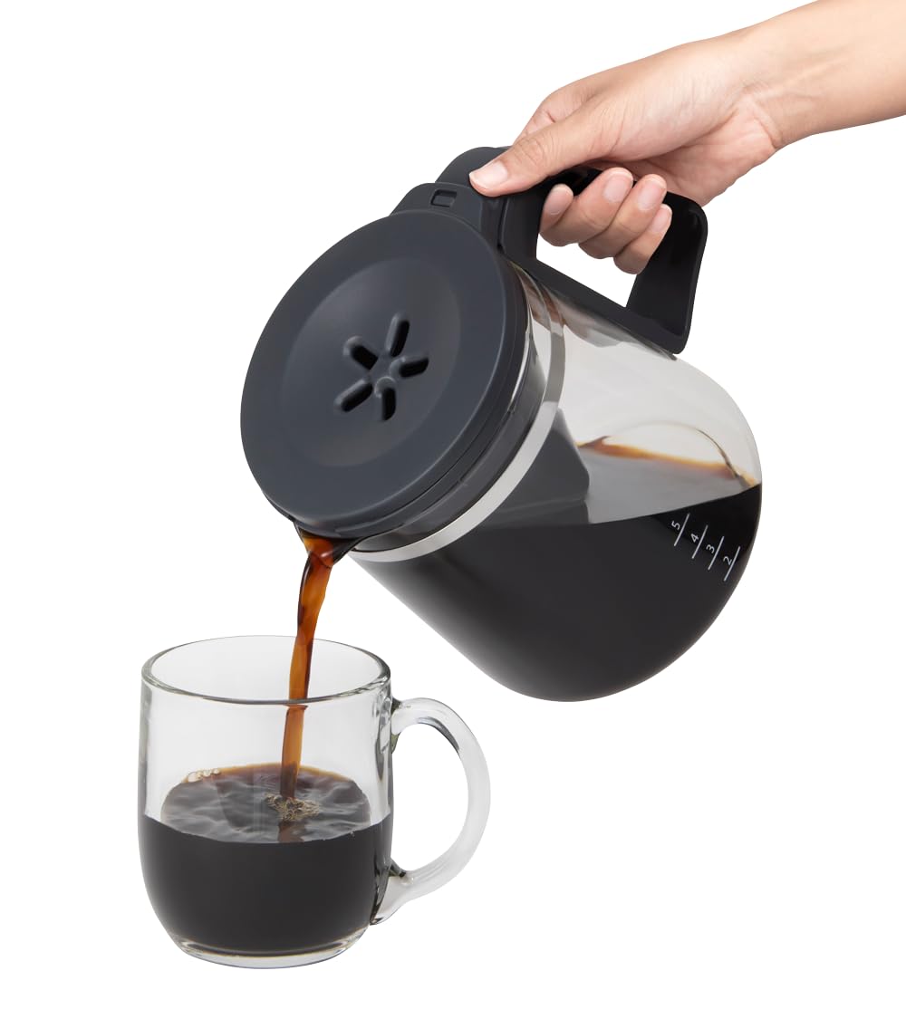 Glass carafe with ergonomic handle and knuckle guard ensures comfortable, protected pouring.
