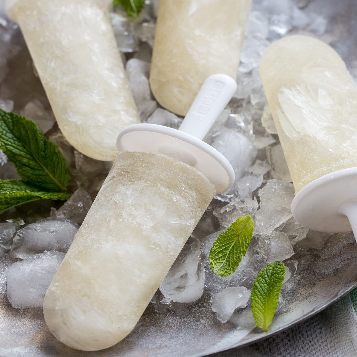 ZOKU Classic Pop Molds drip guards preventing mess and drips during handling.