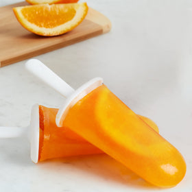 ZOKU Classic Pop Molds sticks securing pops during freezing for clean release.