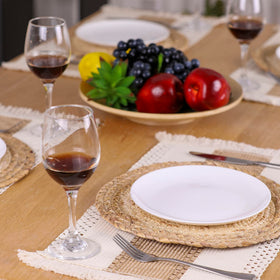 Zology placemats closeup showing cotton tassels for a cozy farmhouse look.