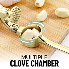 Zulay Kitchen gold garlic press in action delivering smooth, crack-free mincing.