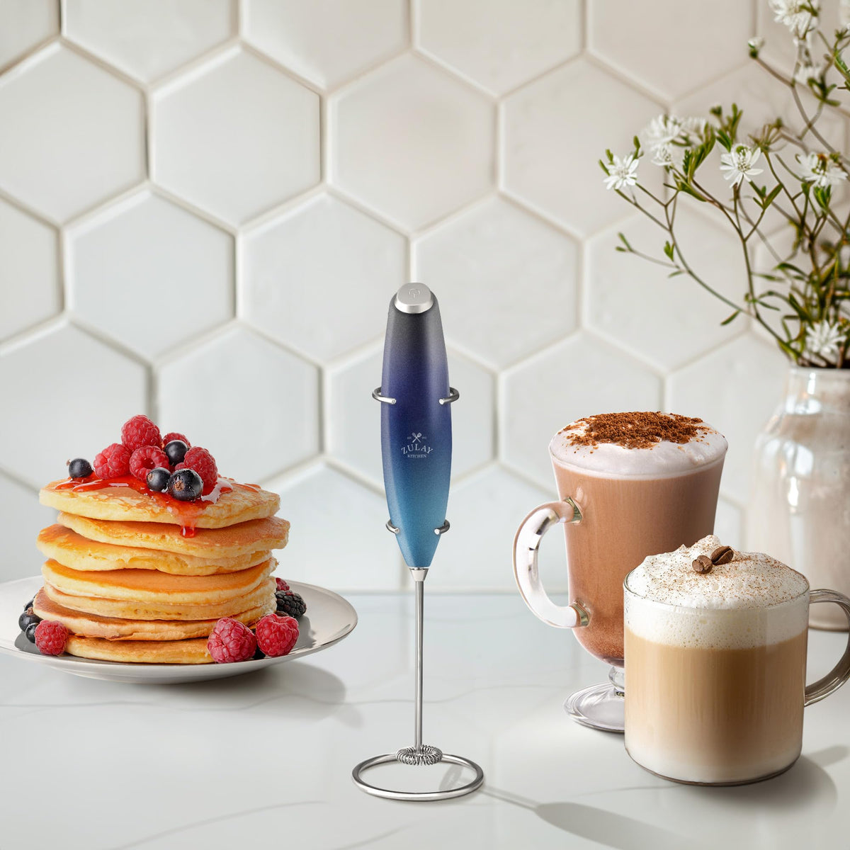 Close-up of creamy latte foam created by the Zulay frother wand.