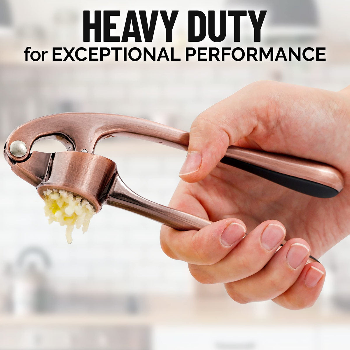 Zulay silicone garlic peeler beside the press for clean prep