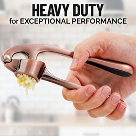 Zulay silicone garlic peeler beside the press for clean prep