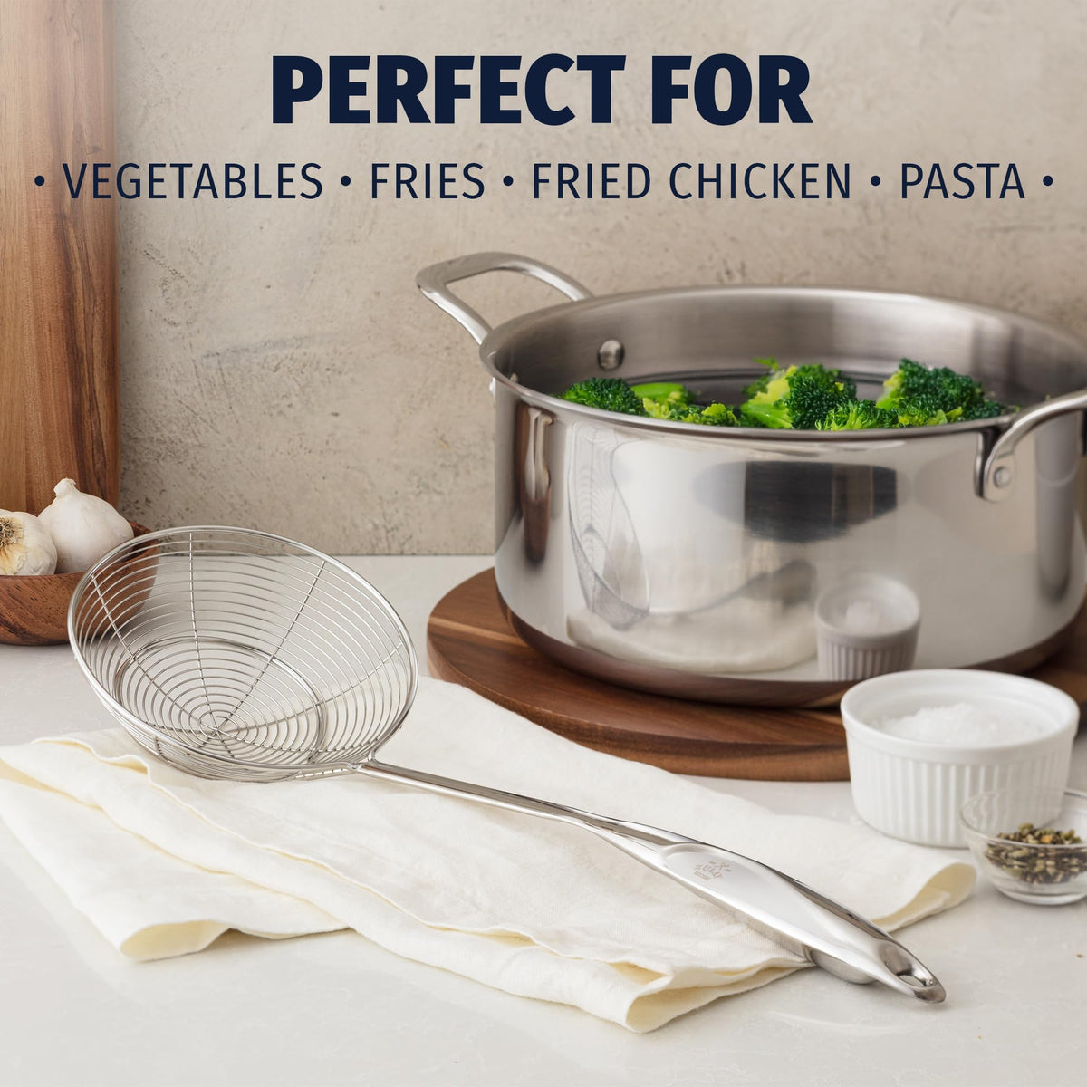 Zulay Kitchen stainless steel skimmer ladle frying use highlights heat resistance and easy maneuvering.
