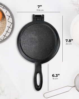 ZURRITO seasoned cast iron waffle iron showing natural non-stick development.